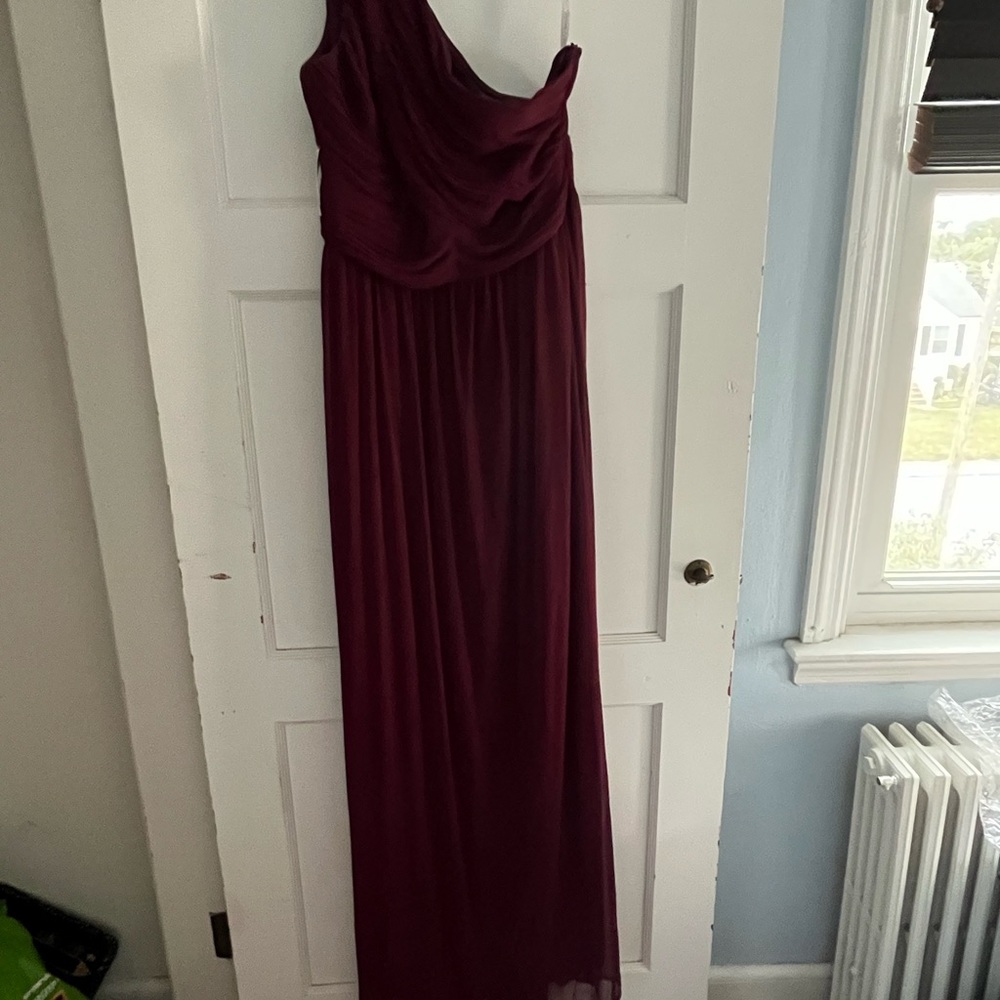 Wine colored bridesmaid dress size 8 never worn or altered.